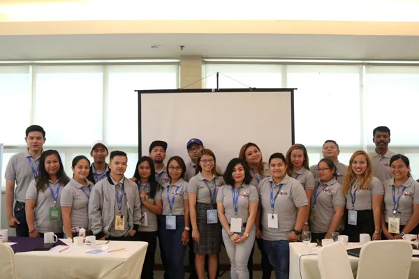 Group photo of BRIDGE 2019 participants in the conference hall
