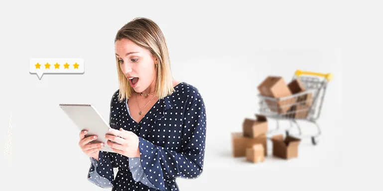 Surprised shopper using a tablet with a shopping cart and five-star rating