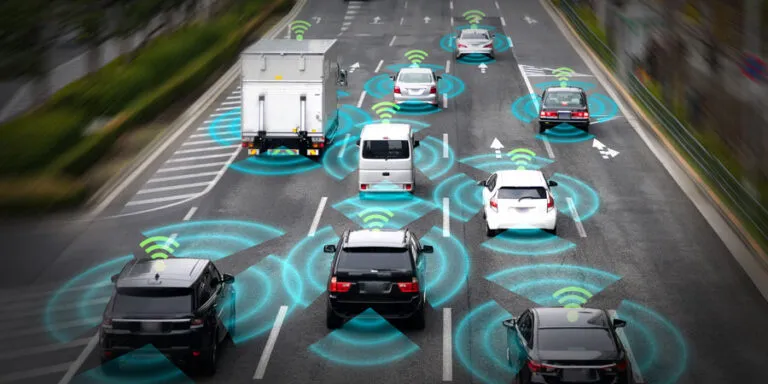Annotated traffic scene with cars and trucks tracked by bounding boxes