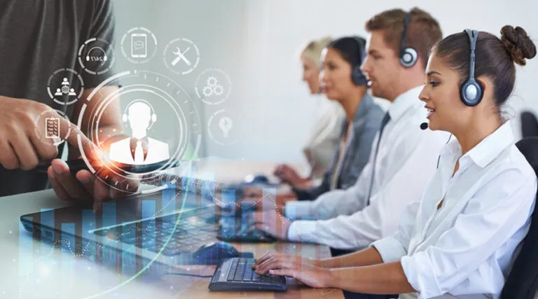 Help desk agents in headsets working at computers with digital icons