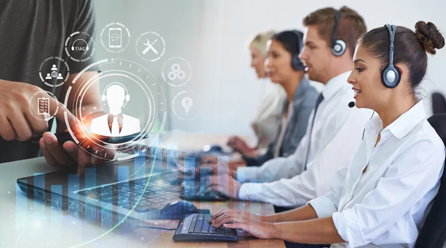 Help desk agents in headsets working at computers with digital icons