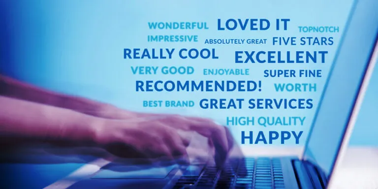 Customer feedback words such as excellent and recommended over a laptop keyboard