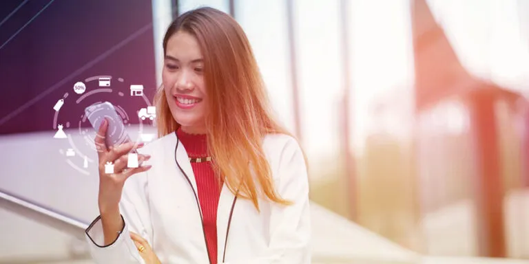 Woman using a phone surrounded by digital shopping icons