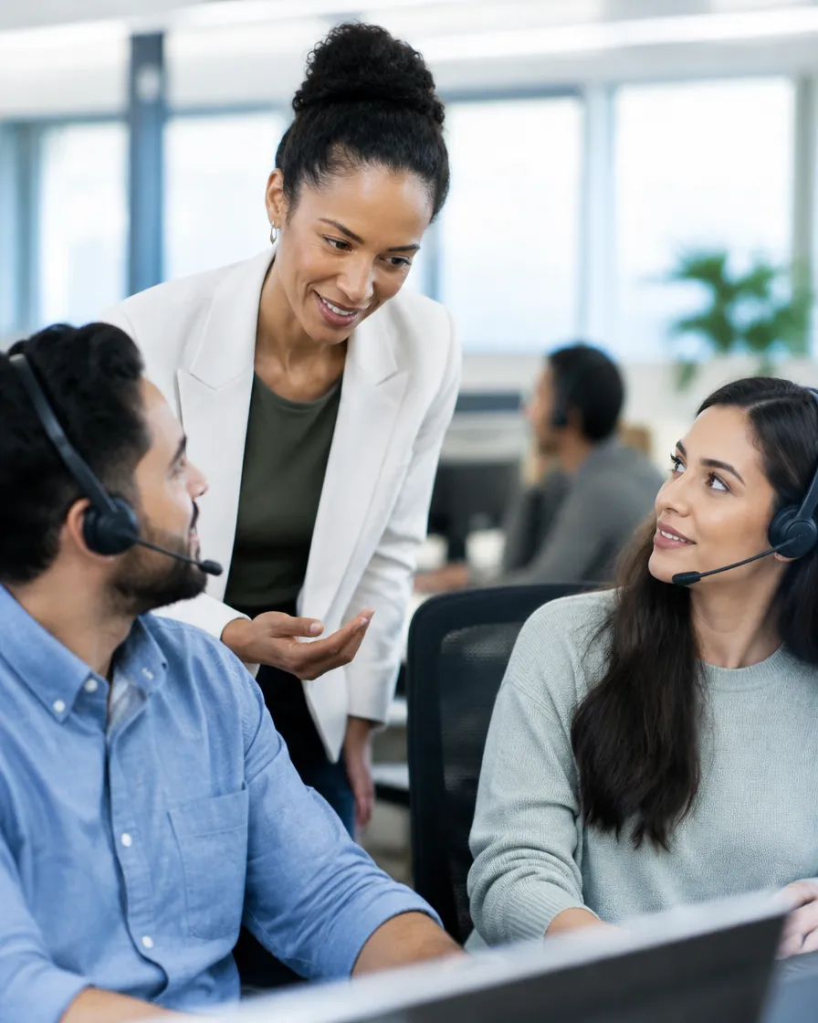 Collections team lead coaching agents on compliant conversations