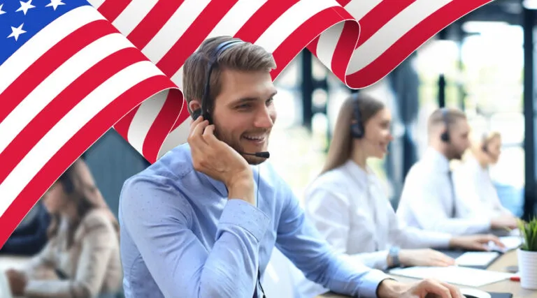Agent in a headset at work in front of an American flag